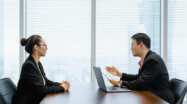Person researching company on a laptop