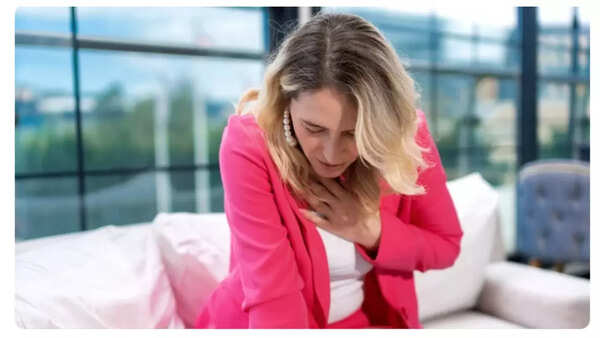 Man clutching his chest in pain