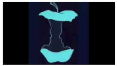 A mind-bending optical illusion with an apple and two faces.