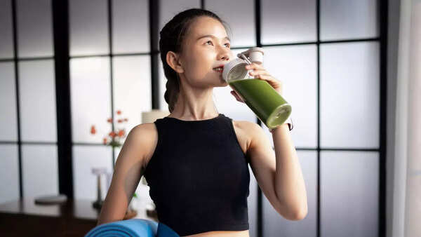 Woman enjoying a healthy smoothie.