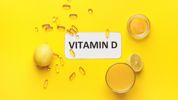 Assortment of vitamin D rich foods and supplement capsules.